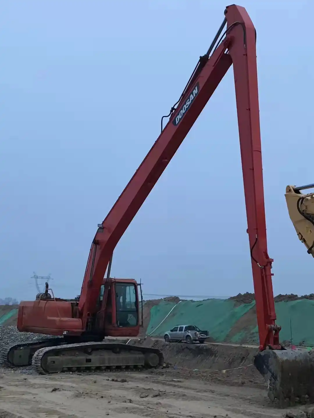 What is the maximum reach of an excavator?